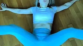 petite fitness babe stretches her body in tight leggings homemade workout