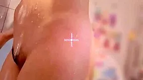 sensual asian babe teases wet pussy and curves under steamy shower water