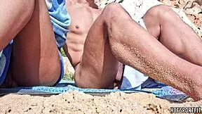 fit couple strips naked on beach for mutual handjobs and masturbation