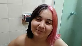 This young pregnant girl loves showing off her belly while peeing homemade