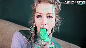 Ever seen a tattooed hippie gape her asshole with a massive dildo?