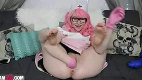 Redhead teen spreads wide on webcam fisting pinky pussy deep with gloves.