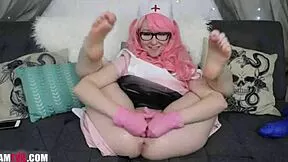 Redhead teen spreads wide on webcam fisting pinky pussy deep with gloves.