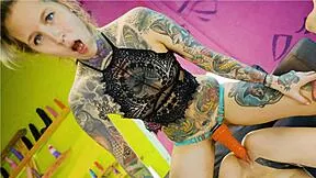 Tattooed goth straps on huge orange dildo to train shy petite teen's eager pussy relentlessly