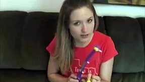 Petite teen strips clothes and plays alone on sofa
