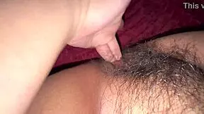 Hot Indian girl fingers her hairy pussy moaning horny