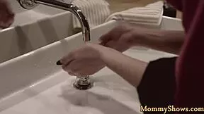 Classy dyke milf straps on to fuck stepdaughter's pussy in lesbian 3some storyline.