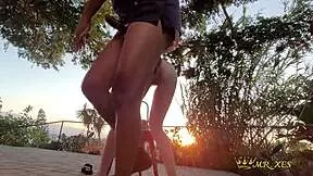 Redhead gets caught on outdoor patio during intense public encounter at sunset