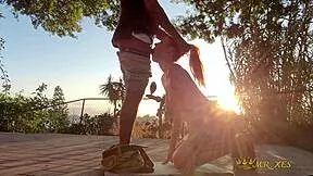 Redhead gets caught on outdoor patio during intense public encounter at sunset