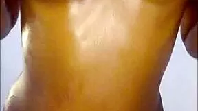 ebony slut oils up huge tits and begs for your hot jizz close-up?