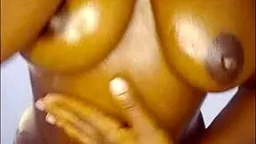 ebony slut oils up huge tits and begs for your hot jizz close-up?