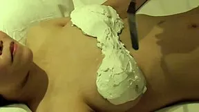 hey girlfriend, watch this big-titted japanese beauty cover her boobs in whipped cream then lick it all off close-up in bed.
