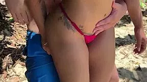 guy yanks bikini aside and pounds her hard on the beach