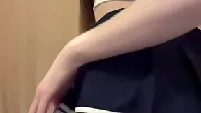 TikTok cutie dances in sexy fishnets, miniskirt, and stockings flashing small tits and panties.