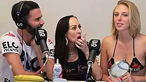 blonde and brunette share banana topped with cream in playful licking scene