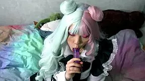Does the horny maid deepthroat toys while teasing her slave pussy closeup?