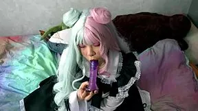 Does the horny maid deepthroat toys while teasing her slave pussy closeup?