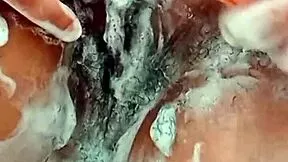 this young latina brunette shaves her hairy pussy close up in the bathroom