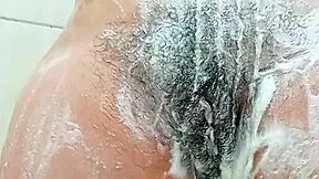 this young latina brunette shaves her hairy pussy close up in the bathroom