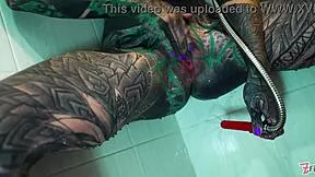 Tattooed model does intense shower anal!