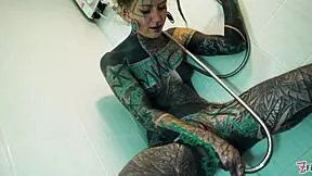 Tattooed model does intense shower anal!