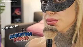Petite tattooed blonde plays with brush