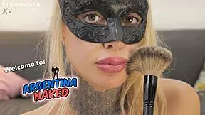 Petite tattooed blonde plays with brush