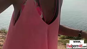 Thai teen gives quick beach blowjob