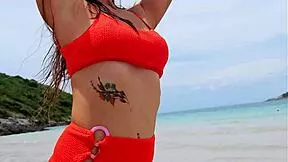 orange bikini beauty flashes on beach