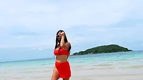 orange bikini beauty flashes on beach