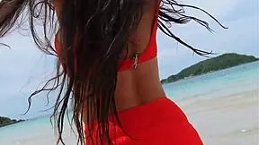 orange bikini beauty flashes on beach