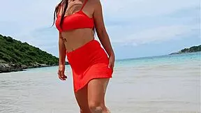 orange bikini beauty flashes on beach