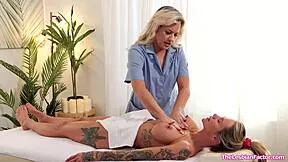 Lesbian masseuse making her big tits milf customer squirt