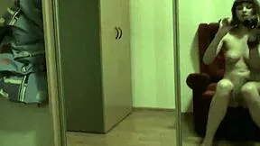 brunette enjoys solo masturbation in the living room
