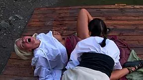 Gorgeous babes experience sensual delight by the lake