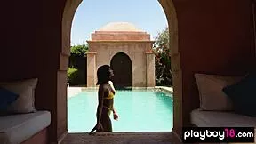 petite asian teen strips naked and relaxes by pool