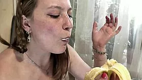 blonde milf and brunette virgin eat banana in kitchen