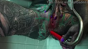 Tattooed model fingers ass and gaps in shower