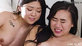 Tattooed blonde fingers two slim asian babes